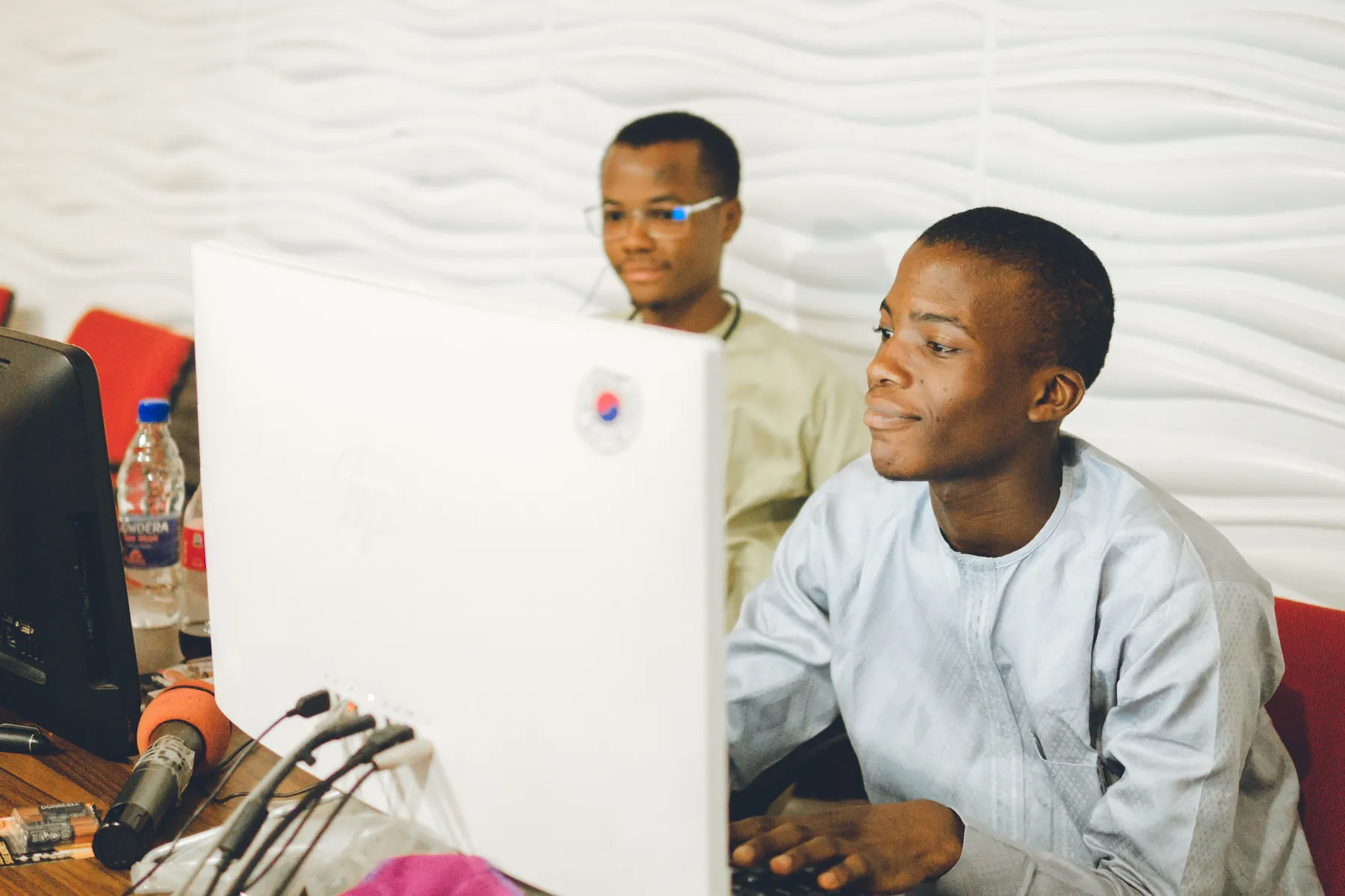 Young professionals working at desktop computers