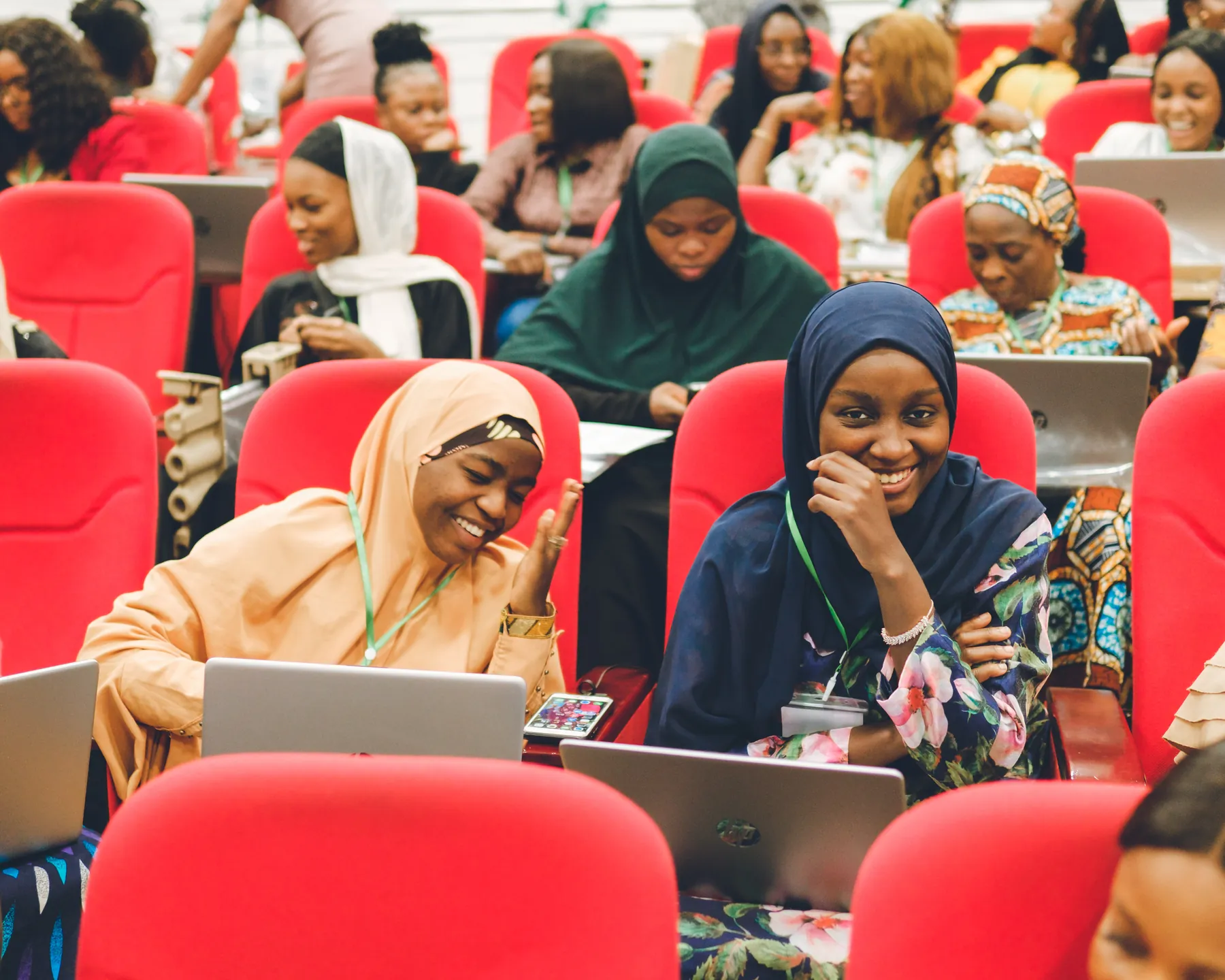 A group of women learning together with laptops